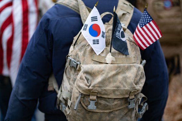 A student veterans backpack is decorated with flags.