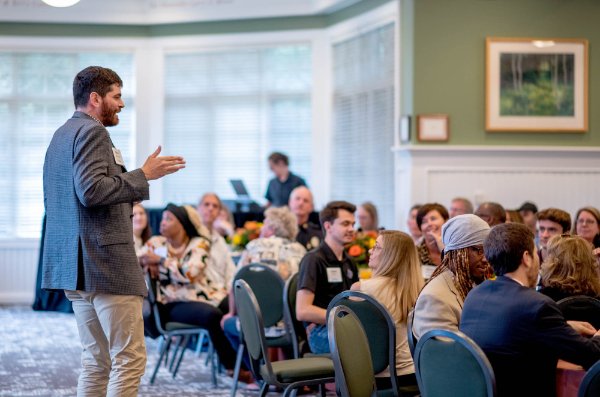 Kevin McIntosh with One America Movement leads the discussion at the Talking Together kickoff reception. 