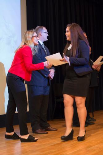 Photos by Bernadine Carey-Tucker  Polly Diven, professor and director of International Relations, shakes hands with a new U.S. citizen at the DeVos Center.