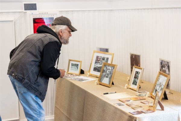 Alumni explore old photos during the Golden Reunion.