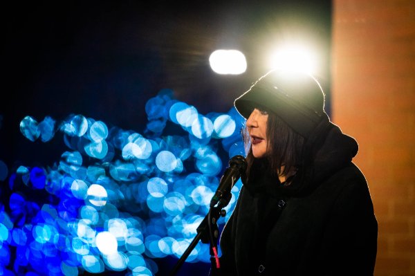 Image of President Mantella speaking into a microphone 