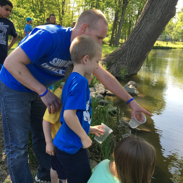 Jeff Bouwman, '03, incorporates fish research into his middle school science classes through a DNR program.