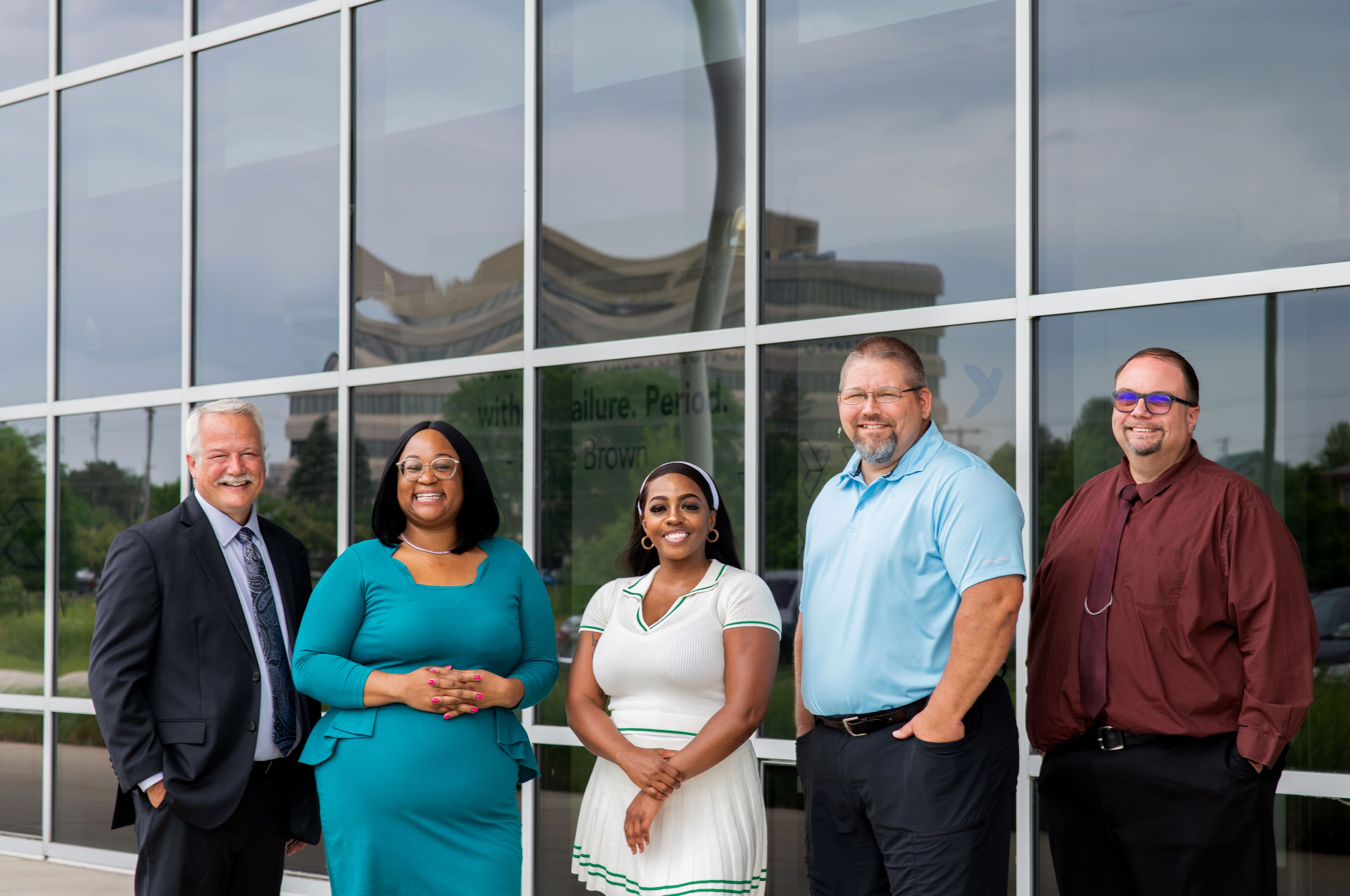 The finalists for the 2025 Innovator of the Year pose for a portrait outside the Muskegon Innovation Hub.