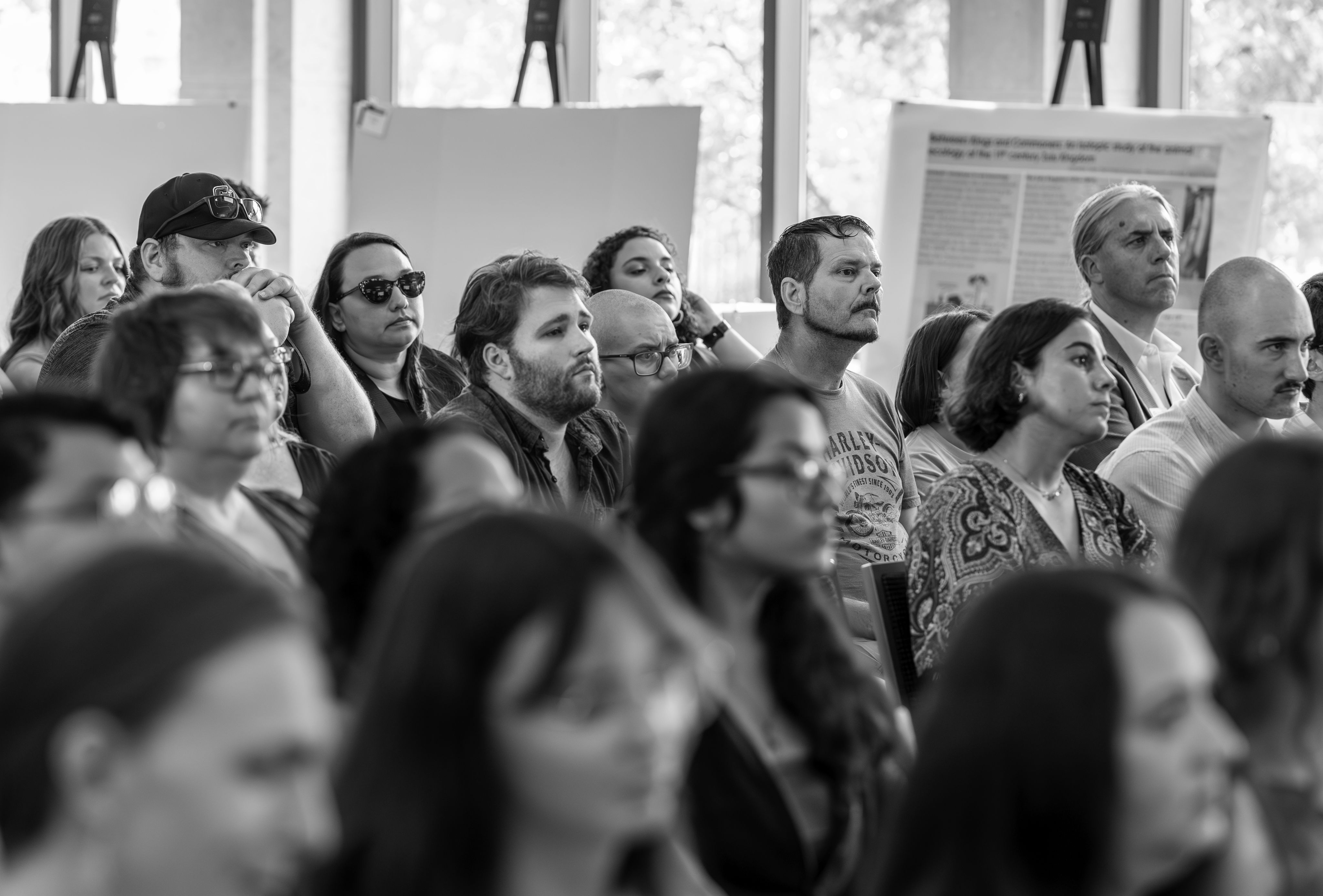 A black and white photo of onlooking audience members.