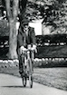 Bill Seidman riding his bike on Grand Valley’s campus