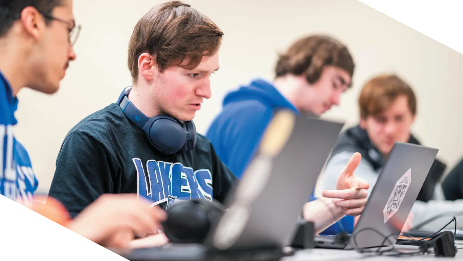 Students at Grand Valley State University collaborate on a cybersecurity exercise, engaging in hands-on learning that mirrors real-world scenarios.
