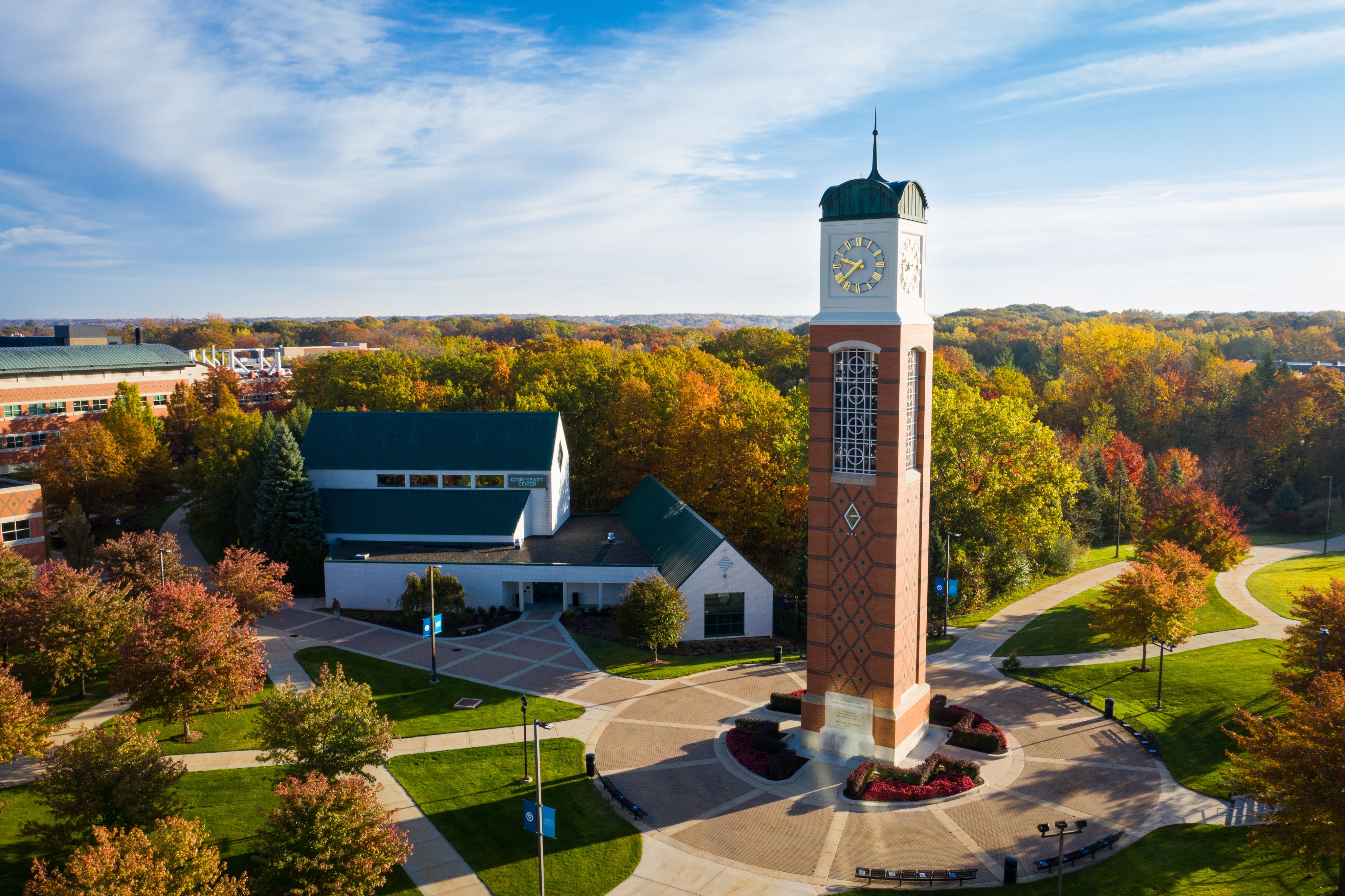 aerial view of Allendale GVSU csmpus focused on the carillon clock tower and the Cook Dewitt Center in fall